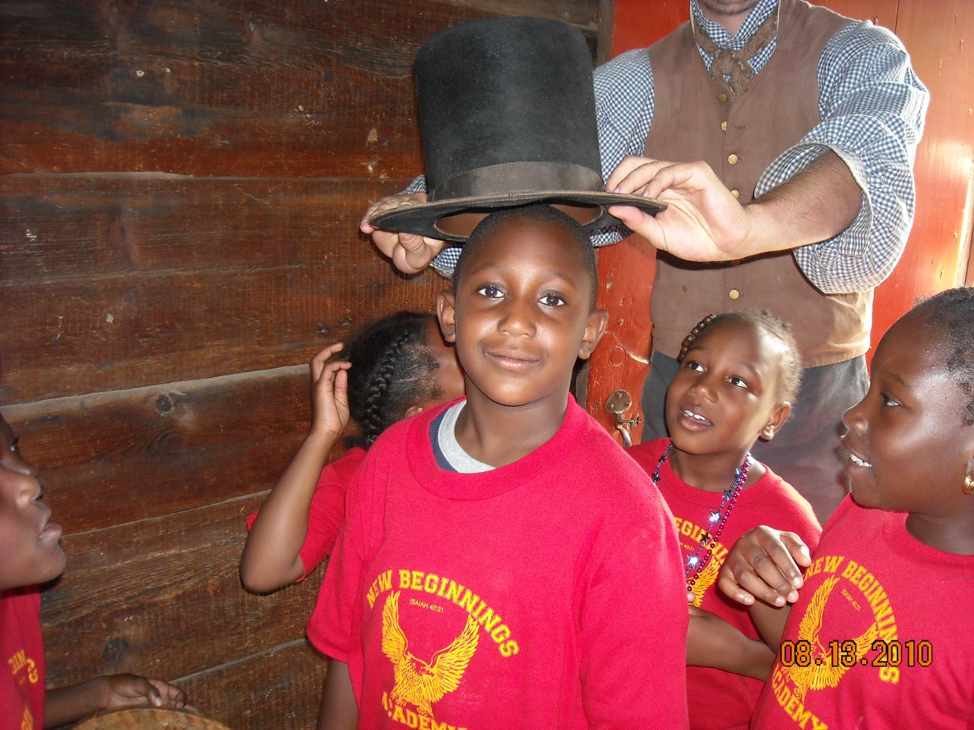 Students in red academy shirts on a school trip